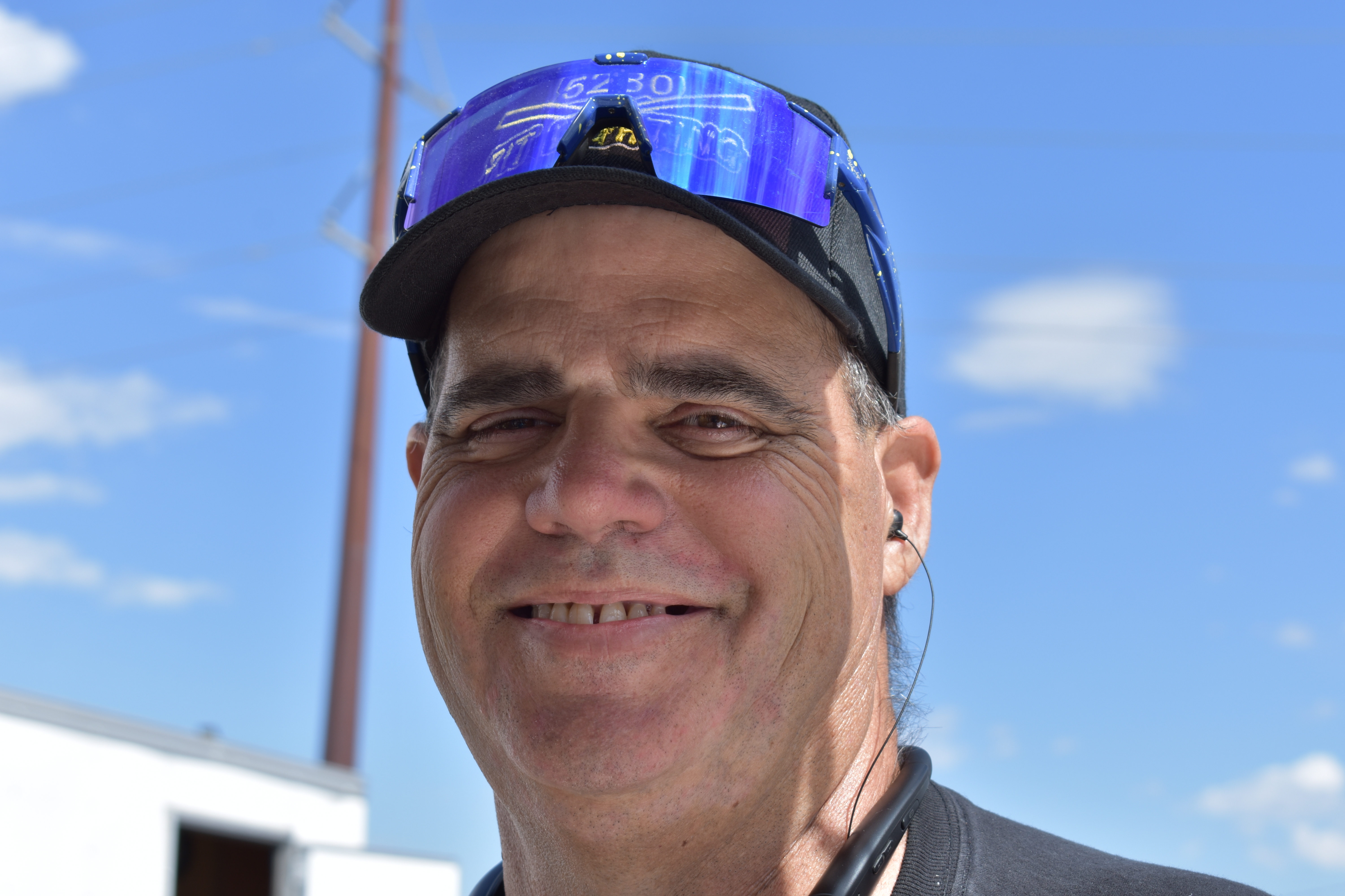 A man wearing a ball cap.